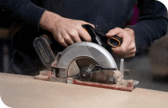 man working chop saws