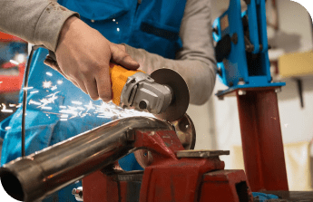 technician workers cutting metal